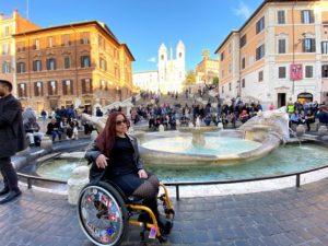 Laurita poses in her wheelchair in front of the Spanish Steps in Rome, Italy.